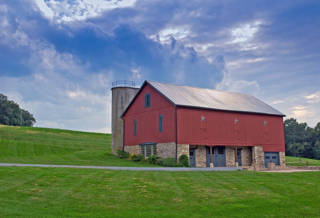 Red barn under a wide sky