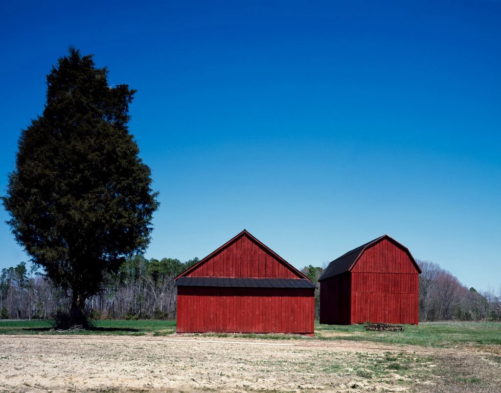 Two red barns on an Amish farm